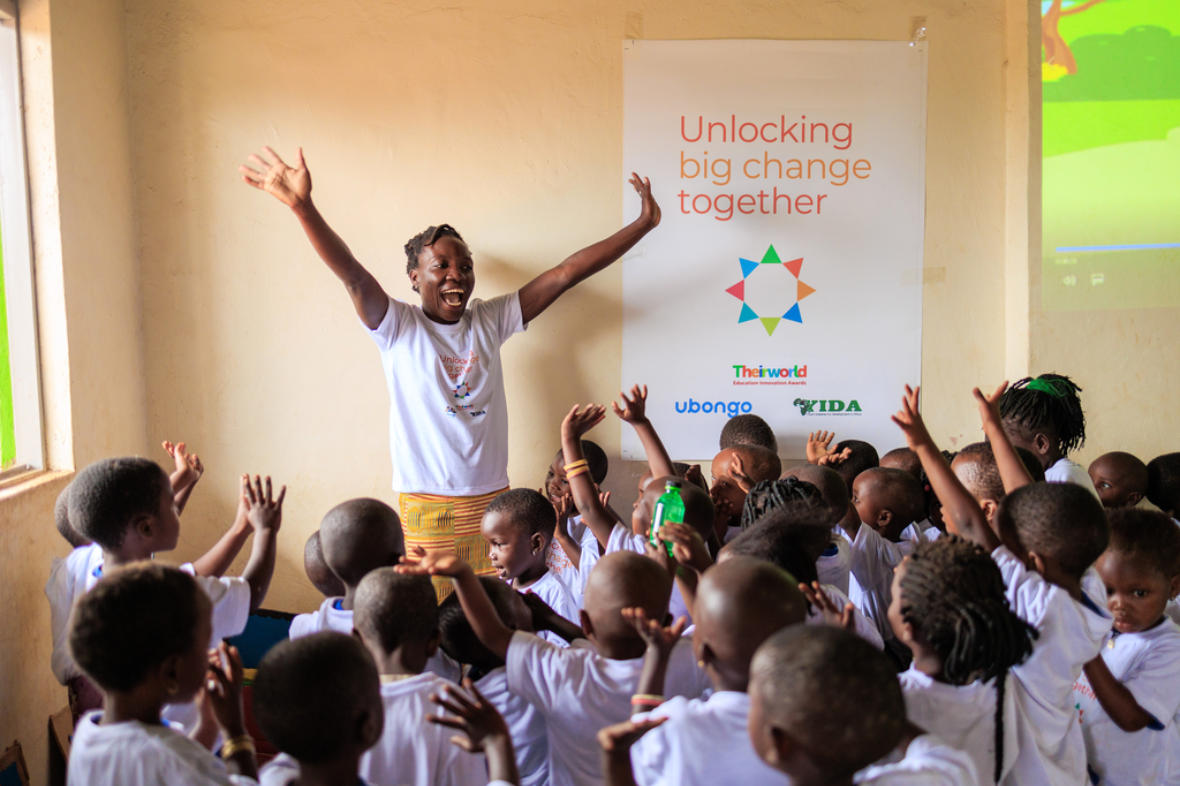 Mireille Nininahazwe from Ubongo leads the community session. Photography from Education Innovation Awards winner Ubongo's community event for 3-6 year olds at Kyaka II refugee settlement, held at the centre of their local partner, Youth Initiative for Development in Africa (YIDA). This community event was held as part of the scaling up plan funded by the Education Innovation award grant.